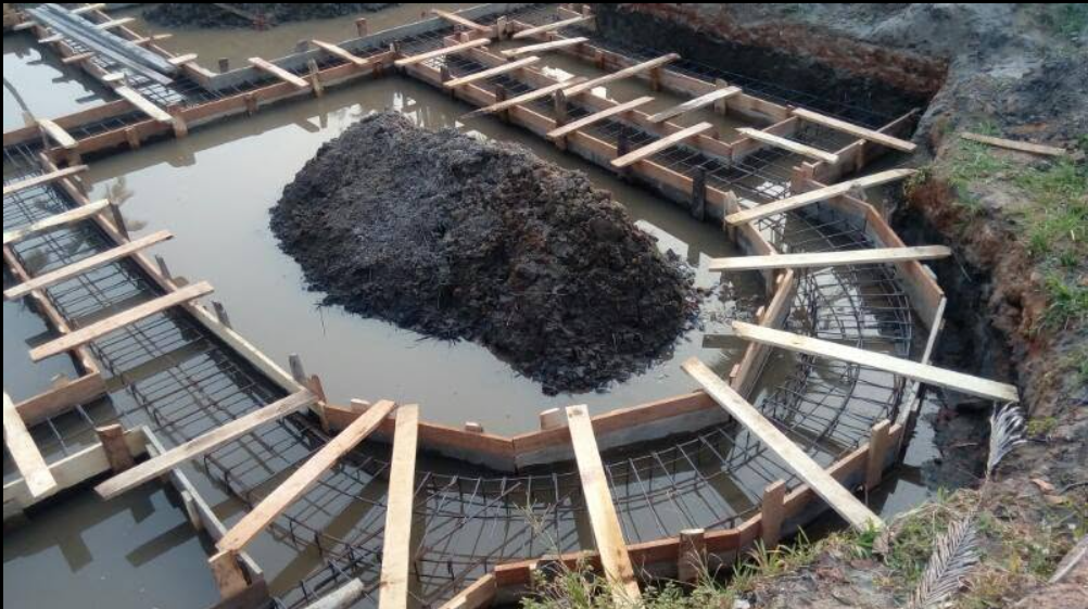 Close view of reinforced foundation beams and timber supports